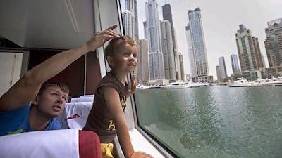 Users of the Go4it Visa gold debit card are entitled to benefits that include free ferry rides from Al Ghubaiba to Burj Al Arab. Jeff Topping / The National