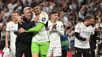 Real Madrid manager Carlo Ancelotti and goalkeeper Thibaut Courtois celebrate victory. AFP