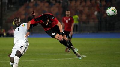 Egypt's Ashour, right, jumps for the ball with Guinea's Naby Laye Keita during their soccer match in Group D 2023 Cup of Nations (AFCON) qualifiers at Cairo International stadium in Cairo, Egypt. Egypt won 1-0. AP Photo