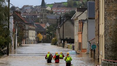 French firefighters in a flooded street in Saint-Etienne-au-Mont in northern France after heavy rain caused the La Liane river to burst its banks. Reuters
