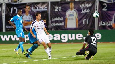 Al AIn's Alex Brosque scores his side's third goal against Dibba Al Fujairah at Khalifa bin Zayed Stadium. Jake Badger/The National
