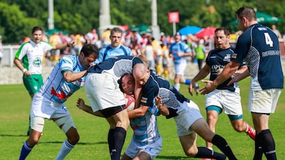 Gulf Legends (dark blue) v Airbus (light blue stripes) during Day 1 of the Emirates Airlines Dubai Rugby Sevens at The Sevens in Dubai on Thursday. Victor Besa for The National