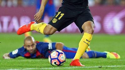 Atletico Madrid’s Angel Correa scores against FC Barcelona. Toni Albir / EPA