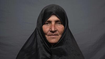Silk weaver Maryam Osmani, 50, poses for a portrait in Herat.