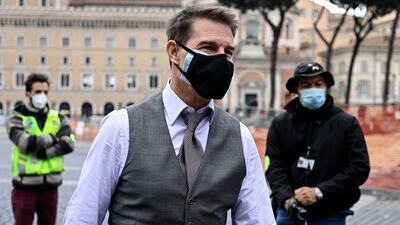 Tom Cruise wears a face mask during the shooting of 'Mission: Impossible 7' at Piazza Venezia in Rome, Italy, on November 29, 2020. EPA