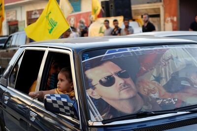 An image of Syria's President Bashar Al Assad is seen on a car's windscreen in the Shiite town of Hermel June 5, 2013. Reuters File Photo