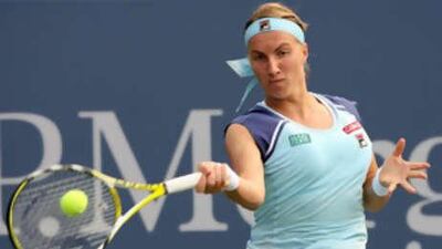 Svetlana Kuznetsova of Russia returns a shot against Katarina Srebotnik of Slovenia.