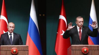 Turkish president Recep Tayyip Erdogan, right, and Russian president Vladimir Putin hold a joint press conference at Turkey's presidential palace in Ankara. Adel Altan / AFP