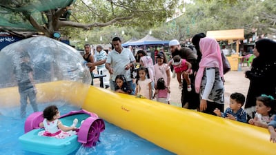 epa06962794 Children play at the popular amusement park 'Horsh Beirut' to celebrate Eid Al-Adha in Beirut, Lebanon, 21 August 2018. Eid al-Adha is the holiest of the two Muslims holidays celebrated each year, it marks the yearly Muslim pilgrimage (Hajj) to visit Mecca, the holiest place in Islam. Muslims slaughter a sacrificial animal and split the meat into three parts, one for the family, one for friends and relatives, and one for the poor and needy. EPA-EFE/NABIL MOUNZER