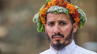 Today, the men still uphold their traditions by wearing garlands in their hair, while working as drivers, soldiers, farmers, and in the tourism industry.