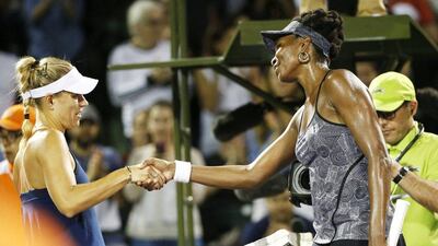 Venus Williams greets Angelique Kerber at the net after their Miami Open quarter-final. Rhona Wise / EPA