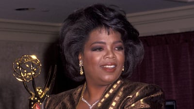 Opray Winfrey wears yellow and black tailoring to attend the 19th Annual Daytime Emmy Awards on June 23, 1992. Getty Images