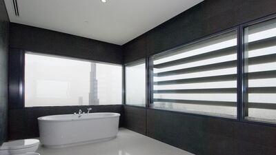 Bathe in style in this four-bedroom apartment in the Index Tower in Dubai. Courtesy Better Homes