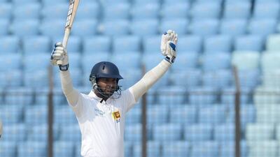 Kumar Sangakkara celebrates his triple-century on Wednesday. Munir uz Zaman / AFP