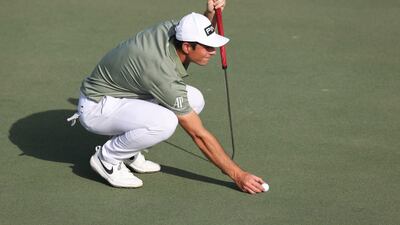 Viktor Hovland of Norway lines-up his putt on the 18th hole. Getty