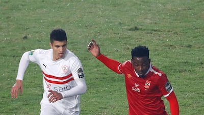 Al Ahly forward Junior Ajayi under pressure from Zamalek's Mohamed Abdel Ghani. AFP