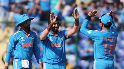 India's Jasprit Bumrah celebrates with Virat Kohli and teammates after taking the wicket of Afghanistan's Ibrahim Zadran, caught by KL Rahul. Reuters