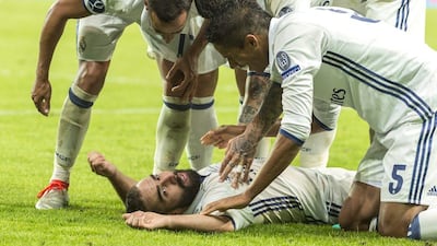 Real Madrid's Dani Carvajal, bottom, celebrates with teammates after scoring his team's third goal against Sevilla during the 2016 Uefa Super Cup 2016 in Trondheim, Norway, Tuesday, August 9, 2016. Real Madrid won 3-2. Ned Alley / NTB Scanpix / AP