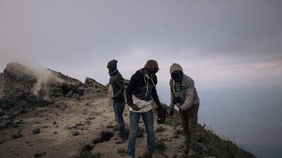 Congolese volcanologists take temperature readings atop Nyiragongo volcano. .