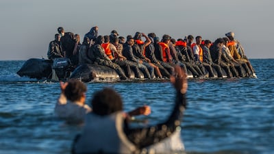 Migrants crammed on to a boat to cross the English Channel in northern France. Getty Images