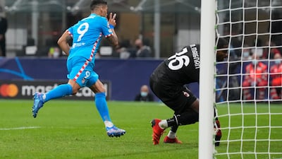Atletico Madrid's Luis Suarez celebrates after scoring an injury-time penalty for a 2-1 win over AC Milan. AP