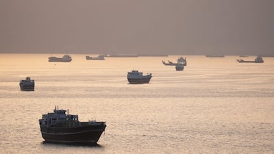 Ships on the Strait of Hormuz, off Musandam, Oman. The narrow channel remains effectively shut, choking oil supply. Reuters
