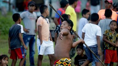 An Embera indigenous man takes part in spear throwing. AP