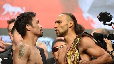 Manny Pacquiao and Keith Thurman face off after weighing in ahead of their WBA welterweight world title fight at the MGM Grand Garden Arena. Reuters
