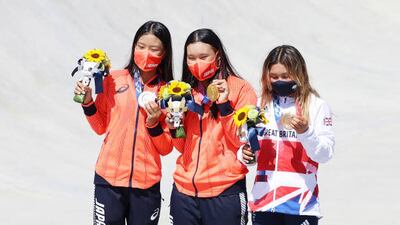 Bronze medalist Sky Brown of Team Great Britain (right); gold medalist Sakura Yosozumi of Team Japan, centre, and silver medalist Kokona Hiraki of Team Japan (pose after the Women's Skateboarding Park Finals.
