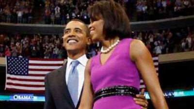 Michelle Obama arrives with her husband, the Democratic presidential hopeful, Barack Obama, for a rally in St Paul, Minnesota. (AP Photo/Chris Carlson, FILE)