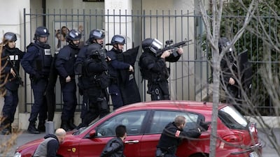 French security forces staged near the post office where an armed man was holed up with two hostages on January 16 in Colombes, outside Paris. The man was later arrested. AFP Photo