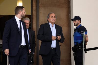 Former Uefa president Michel Platini (c) leaves Switzerland's Federal Criminal Court. AFP