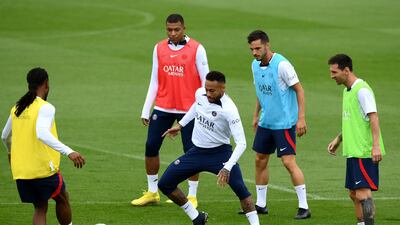 Neymar vies for the ball with midfielder Renato Sanches during training. AFP