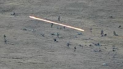 Azerbaijan's soldiers cross the border as they approach Armenian positions. AP