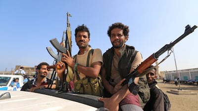 Houthi militants ride on the back of a truck in Hodeidah,. Reuters