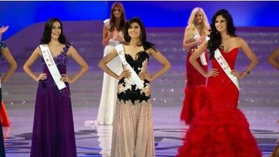 From left, Miss Australia Jessica Kahawaty, Miss India Vanya Mishra and Miss Mexico Mariana Reynoso pose during the Miss World 2012 final ceremony at Dongsheng Stadium in the inner Mongolian city of Ordos on August 18.