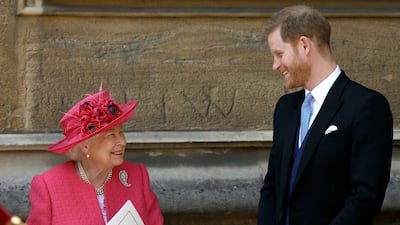 Queen Elizabeth II and Britain's Prince Harry, Duke of Sussex, leave St George's Chapel. AFP