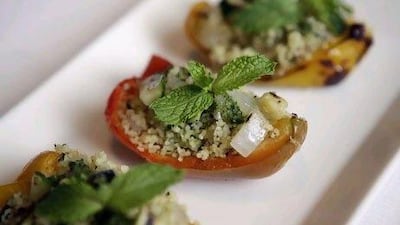 Chilled stuffed peppers with pesto couscous salad and grilled vegetables is offered at Frankie's Restaurant & Bar.