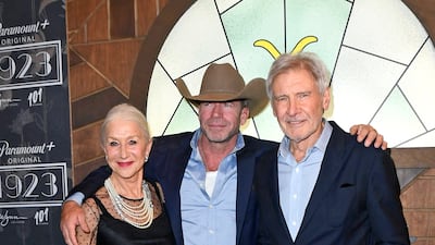 LAS VEGAS, NEVADA - DECEMBER 03: (L-R) Helen Mirren, Taylor Sheridan, and Harrison Ford attend Paramount+'s "1923" Las Vegas Premiere at the Encore Theater at Wynn Las Vegas on December 03, 2022 in Las Vegas, Nevada. Mindy Small / Getty Images / AFP (Photo by Mindy Small / GETTY IMAGES NORTH AMERICA / Getty Images via AFP)
