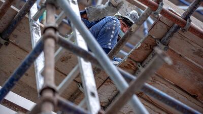 Workers pictured on scaffolding during a site visit on Wednesday