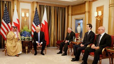 Donald Trump, second left, is flanked by secretary of state Rex Tillerson, third right, senior advisor Jared Kushner, second right, and national security advisor HR McMaster, right, meets with Bahrain’s King Hamad bin Isa Al Khalifa, left, in Riyadh. Jonathan Ernst / Reuters
