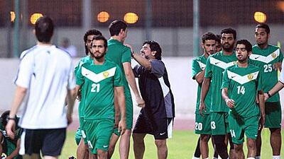 Juan Manuel Olivera and Diego Maradona, centre, share a joke during a Wasl training session. The Uruguayan striker is Maradona's handpicked striker to drive the Dubai club to the UAE title.