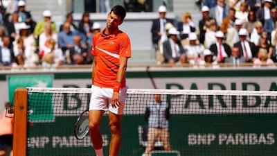 Novak Djokovic reacts after his semifinal defeat to Dominic Thiem. Reuters