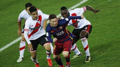 Barcelona’s Lionel Messi with River Plate’s Eder Balanta and Gonzalo Martinez in action. Reuters / Issei Kato