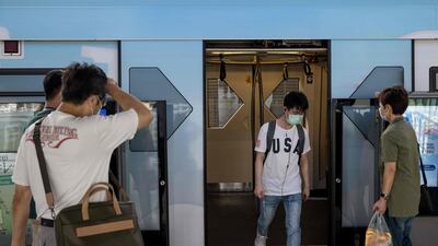 A commuter exits a BTS train in Bangkok, Thailand. AFP
