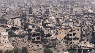 Damaged buildings are seen at the Yarmouk Palestinian camp in Damascus, Syria. April 28, 2018. Omar Sanadiki / Reuters