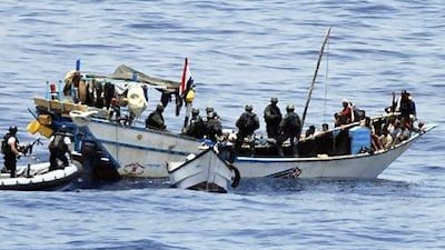 Dutch marines board a Yemeni fishing boat in the Gulf of Aden, which had been captured by Somali pirates. The world's navies are taking a more proactive role in tackling piracy in the region. AP Photo / Defense Ministry Netherlands
