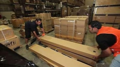 Khuram Shahzad, right, from Pakistan, and Ryan Twittey, an Australian citizen, organise relief supplies in a United Nations warehouse in Dubai's International Humanitarian City.