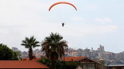 Paragliders fly over the Lebanese coastal city of Jounieh, north of the capital Beirut. AFP