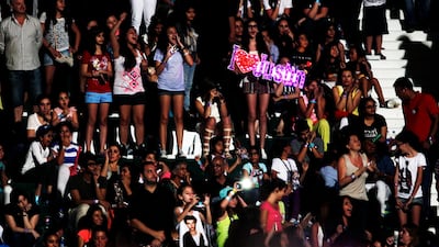 After a two-hour wait for their hero, fans in Dubai quickly forgave Justin Bieber's tardiness and turned up the volume to welcome him to the UAE. Sarah Dea/The National